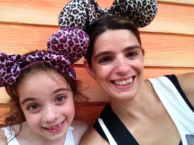 Mom and daughter wearing Minnie ears for the Disney Parks.